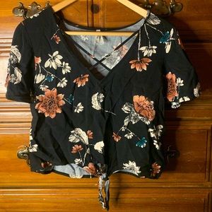 Nice black floral crop top. Only wore a few times just had in closet.